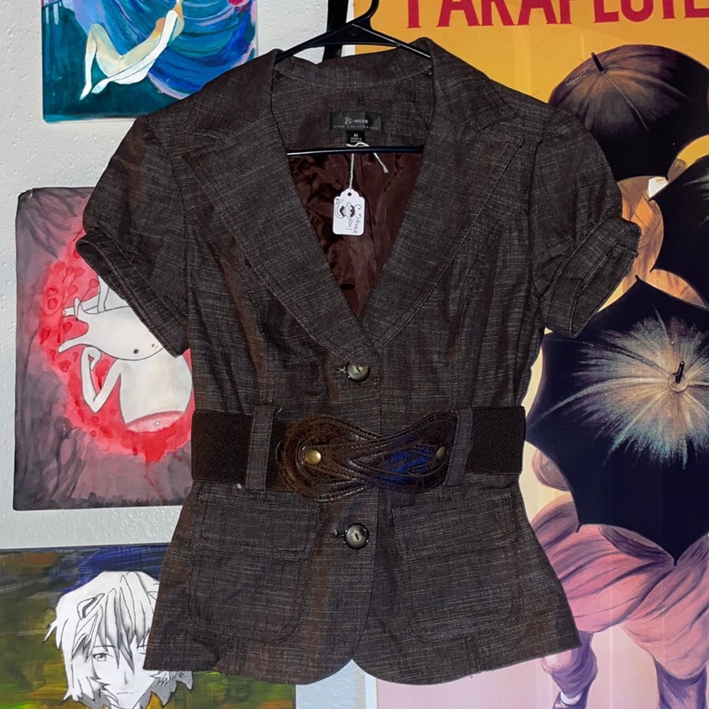 brown button up blouse with a stretchy leather strap belt
